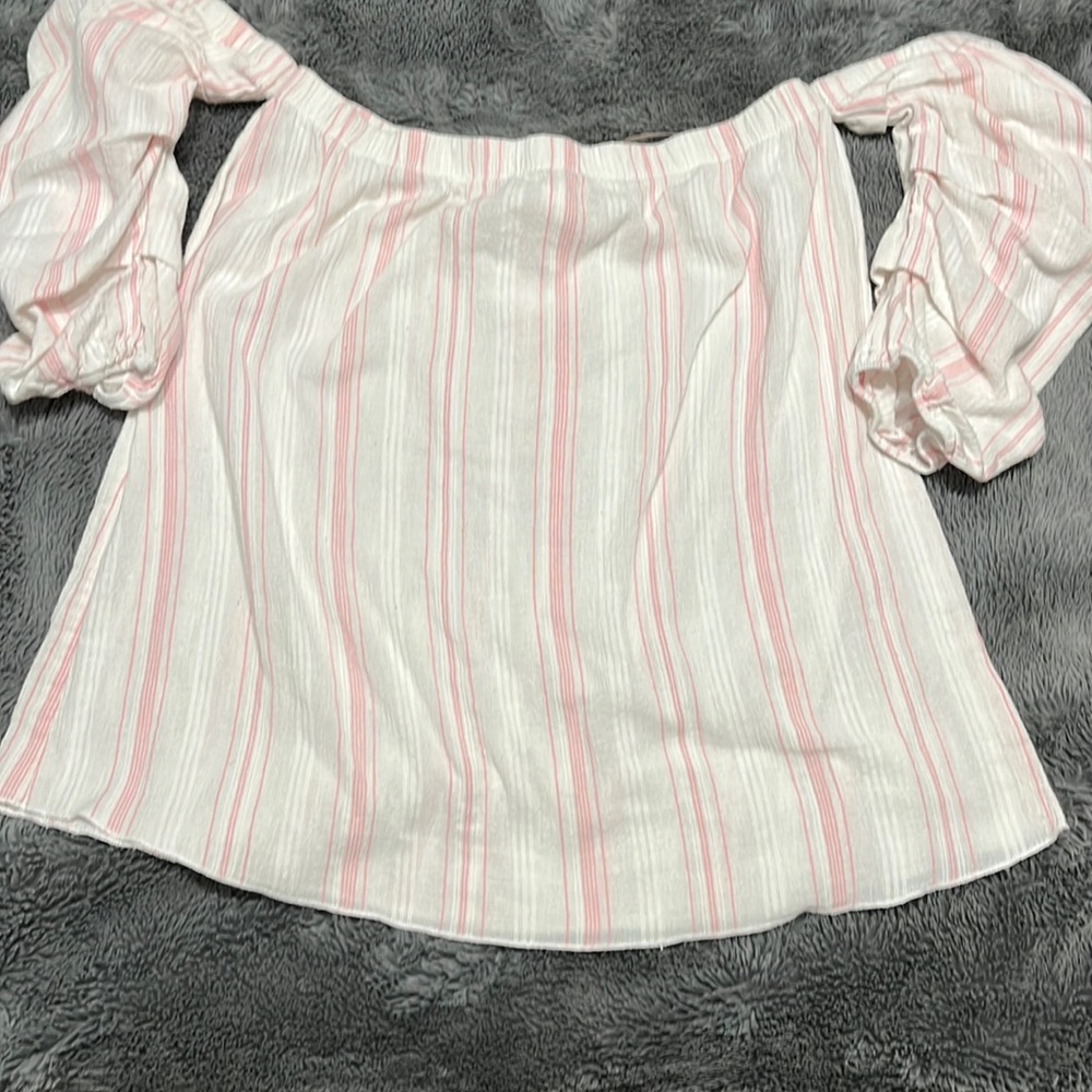 Pink strip off the shoulder top. No stains non smoking home. No pets